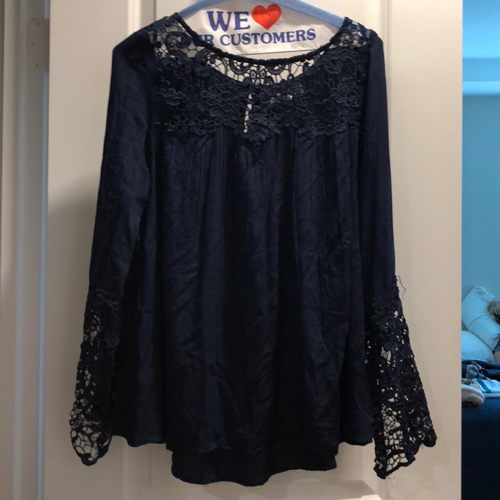 A beautiful navy blue blouse with Lace.